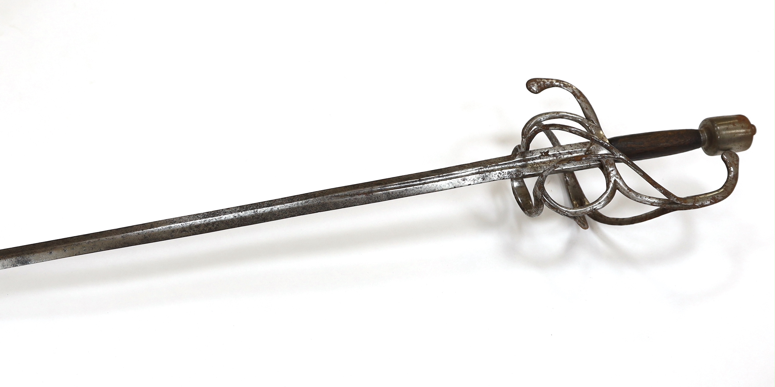 A swept hilt rapier, c.1620, blade fullered at the forte, iron guard of conventional form with later pommel and wooden grip, blade 113cm